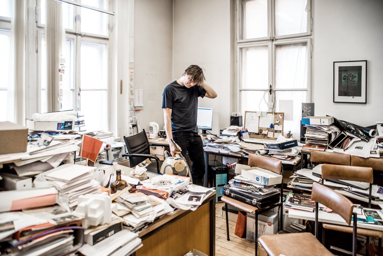 Office Worker Trying to Clean a Messy Office